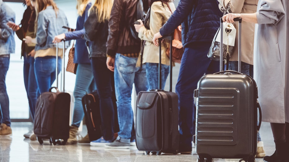 people-in-airport-waiting-in-line