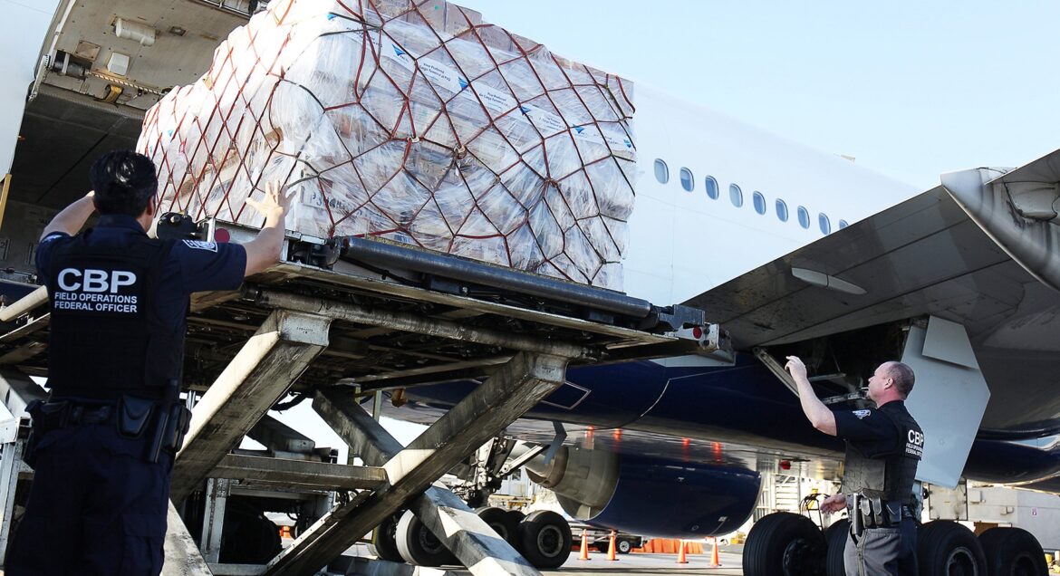 url=http%3A%2F%2Fnpr-brightspot.s3.amazonaws.com%2F25%2Faf%2F447965ef4e5886a29aa8e90e1de5%2Flax-unloading-mail-ya-huei-laura-lee-406a7432-cropped-0
